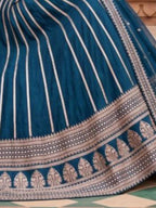 Teal Peacock Blue Heavy Zari Embroidered Silk Readymade Lehenga Choli - Angle View 2