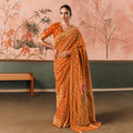Rust Orange Banarasi Silk Saree with Gold Zari Weaving Peacock Motifs and Unstitched Blouse