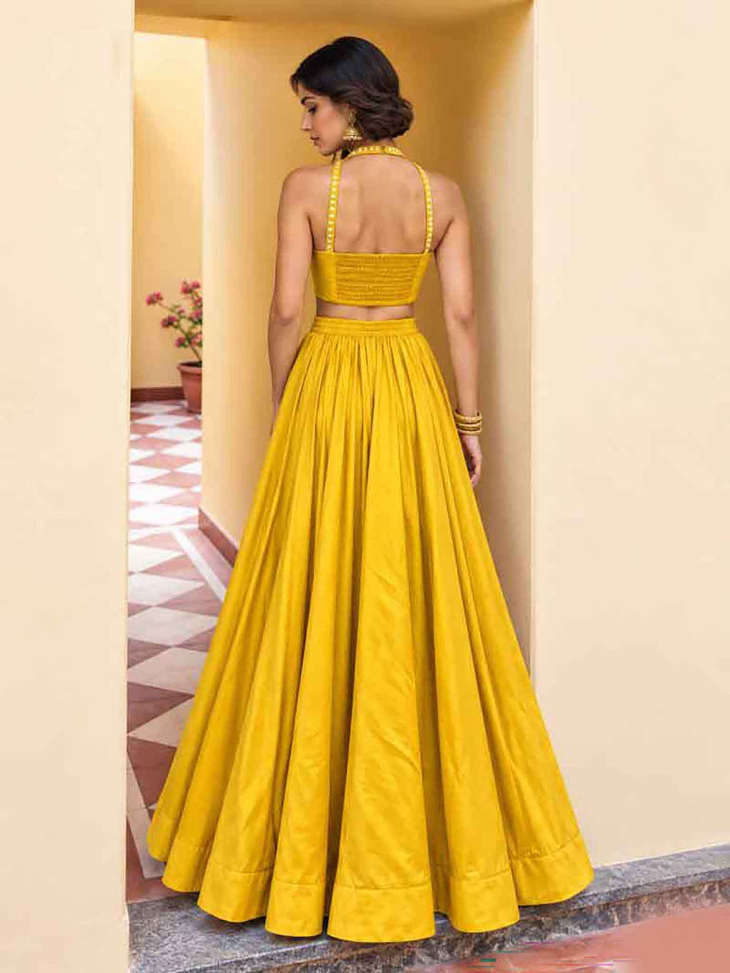 Flared 5.50 meter twirl silhouette and back drape details of Blush Pink Roman Silk Lehenga