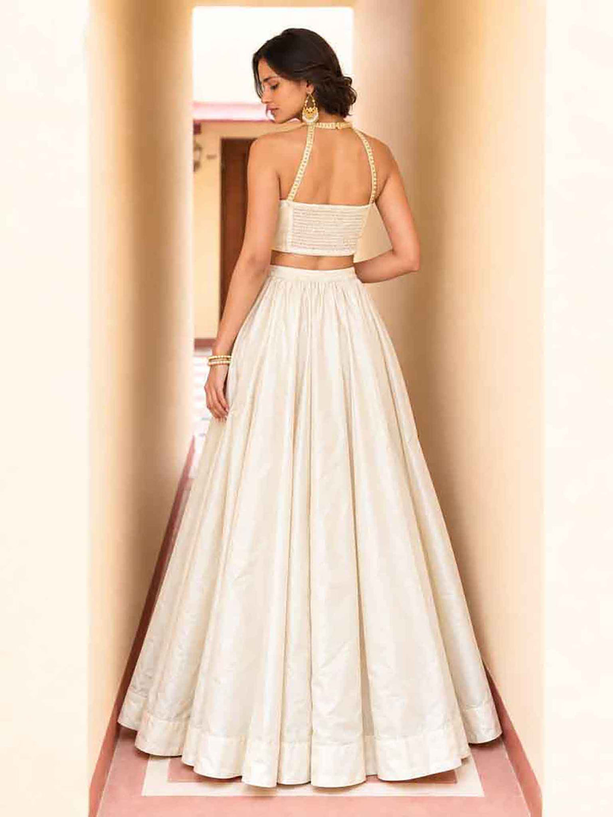 Flared 5.50 meter twirl silhouette and back drape details of Mustard Yellow Roman Silk Lehenga