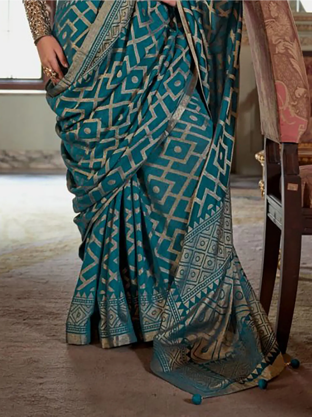 teal blue georgette printed saree pallu and print detail close-up