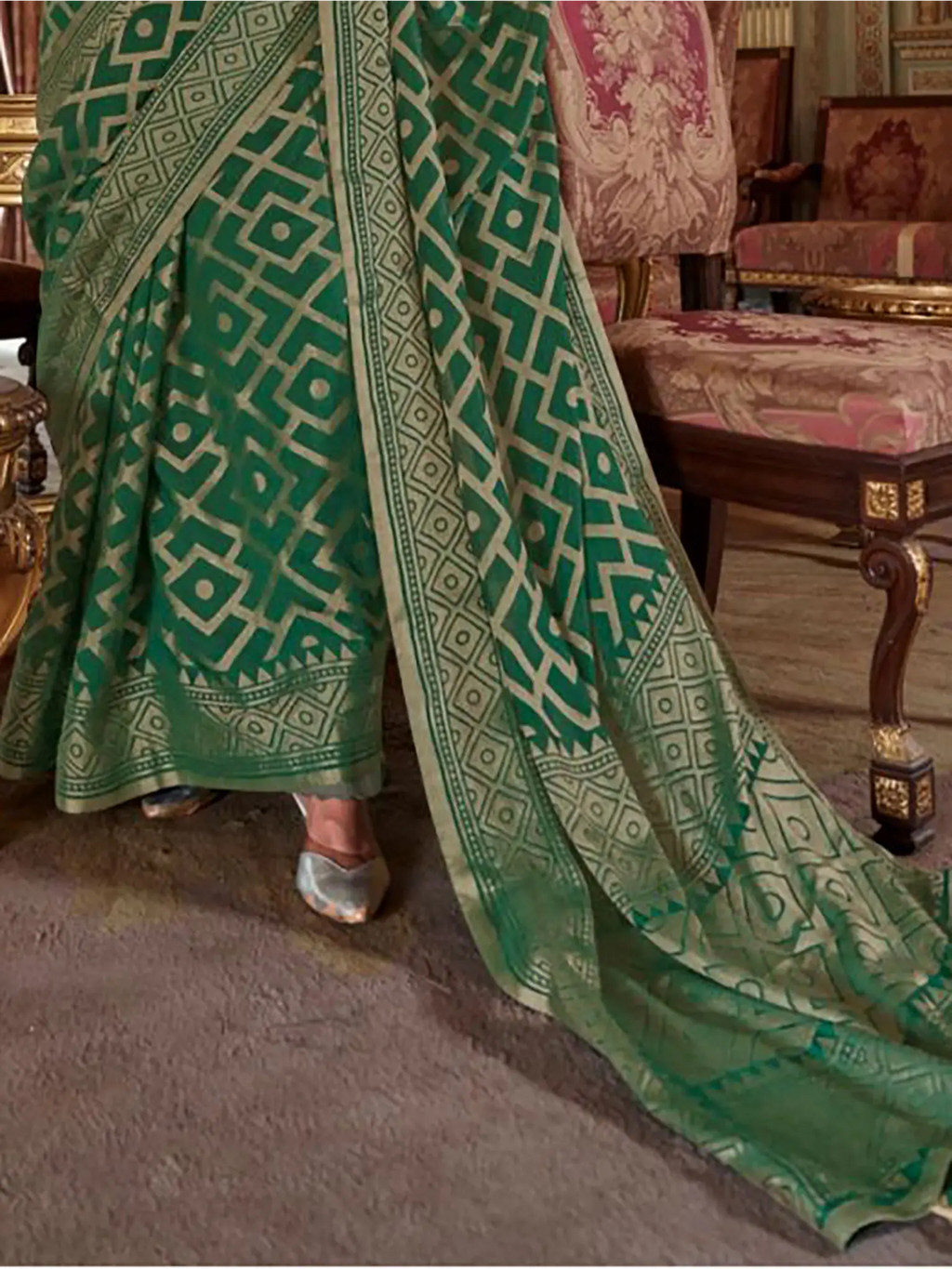 emerald green georgette printed saree pallu and print detail close-up