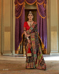 Model in a midnight black Viscose Silk saree with luxury floral print and Marmo finish.