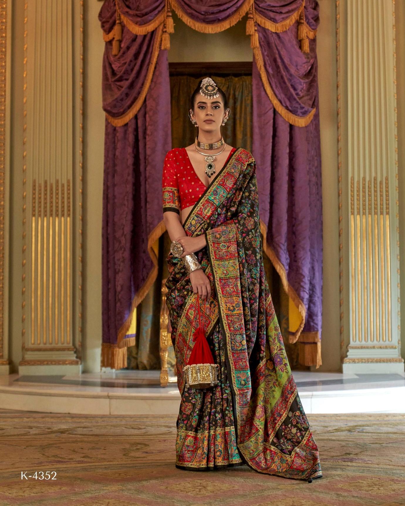 Model in a midnight black Viscose Silk saree with luxury floral print and Marmo finish.