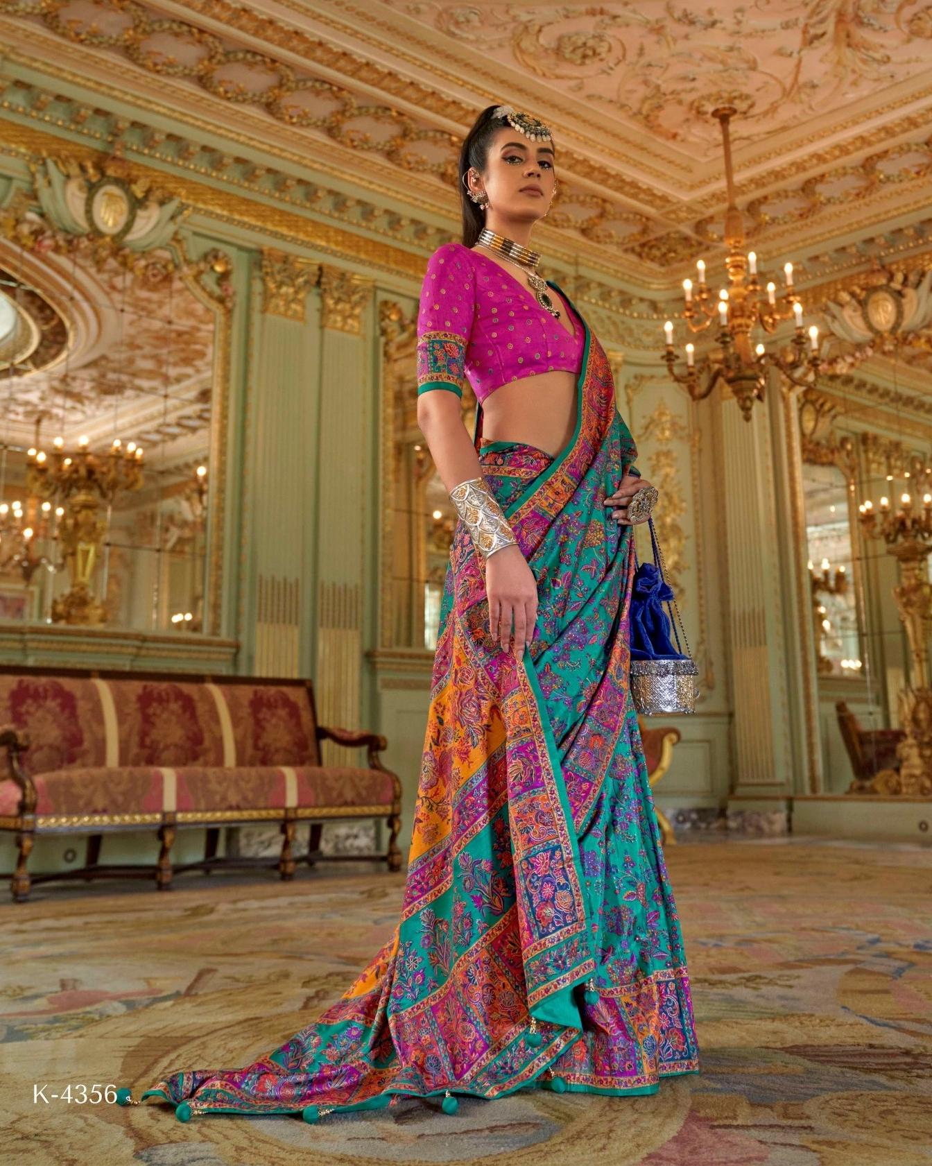 Model wearing a turquoise blue Viscose Silk saree with luxury print and Marmo finish for festive wear.