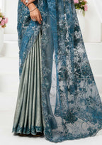 Blue Metallic Lustrous Satin Mono Net Floral Motifs Cutdana Applique Work Saree